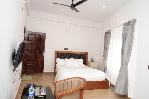 Letto o letti in una camera di Pallakki Comforts Chikmagalur