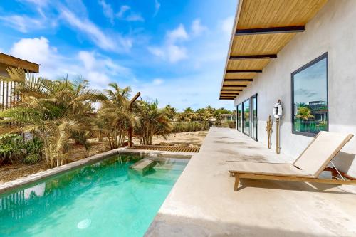 a swimming pool in the backyard of a villa at Seabird - Villa 20 in Placencia Village