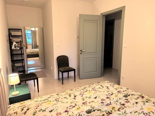 a bedroom with a bed and a room with a mirror at Nocleg w Olecku Parkowa in Olecko