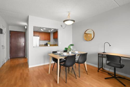 a dining room and kitchen with a table and chairs at Modern Comfort Apartment Close to Metro & Shops in Arlington