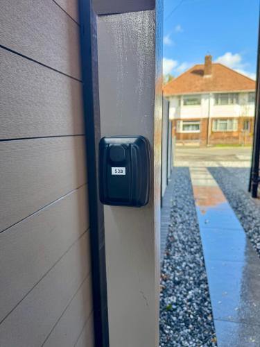 a door with a mailbox on the side of a building at 3 bedroom Brookwood Road apartment in Southampton