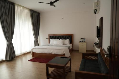 Letto o letti in una camera di Pallakki Comforts Chikmagalur