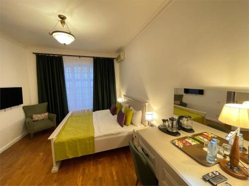 Ένα ή περισσότερα κρεβάτια σε δωμάτιο στο Aldemar Apart Hotel