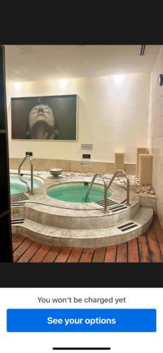 a bathroom with a jacuzzi tub in a room at Vida Vidante in Nuevo Vallarta 
