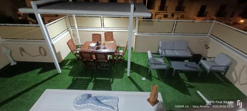a model of a house with a table and chairs at Suite solarium Km21 in Vera