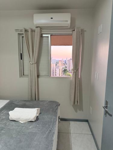 Llit o llits en una habitació de Apartamento no centro