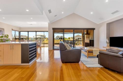 a living room with a couch and a table at Panda Living waterfront paradise in Wannanup