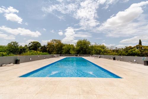 Πισίνα στο ή κοντά στο Departamento Aeropuerto Ezeiza