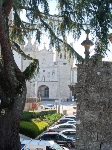 a parking lot with cars parked in front of a building at ChezGyKa - Sinta-se Em Casa! in Viseu