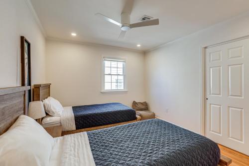 a bedroom with two beds and a door at Walk to Beach! Point Pleasant Home with Heated Pool in Point Pleasant Beach