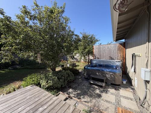 a couch sitting outside of a house at Wavesong Refuge in McKinleyville