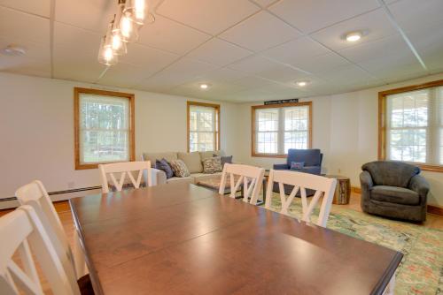 a living room with a large table and chairs at Walk to Lake Winnisquam Access Cozy Retreat in Winnisquam