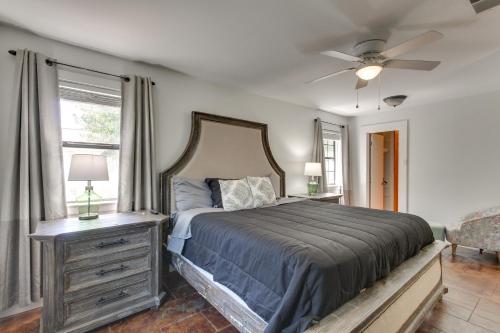 a bedroom with a bed and a ceiling fan at 2 Mi to University and Long Beach Harbor Family Gem in Long Beach