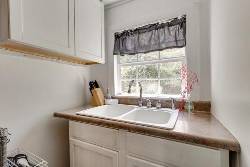 a kitchen with a sink and a window at 2 Mi to Long Beach Waterfront! Convenient Studio in Long Beach
