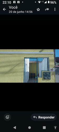 a screenshot of a cell phone screen with a window at Casa da Lu in Aparecida