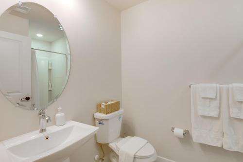 a white bathroom with a sink and a mirror at Modern Gem Near Historic Annapolis and Naval Academy in Annapolis