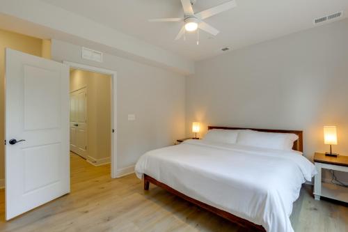 a white bedroom with a bed and a ceiling fan at Modern Gem Near Historic Annapolis and Naval Academy in Annapolis