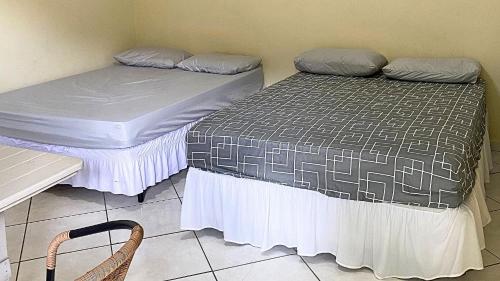 Katil atau katil-katil dalam bilik di Apartamentos Boca da Lagoa | Praia, Mata Atlântica e um Pôr do Sol Inesquecível