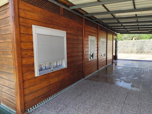 a wooden wall with a window on a building at Casa de madera in Carchuna