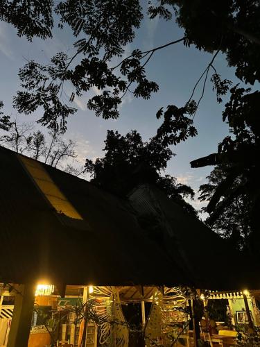 a large black tent with lights in the sky at Caribbean Flow in Puerto Viejo