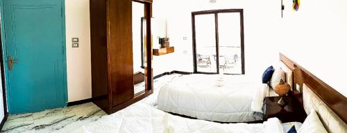 Ένα ή περισσότερα κρεβάτια σε δωμάτιο στο Flower of life guest house