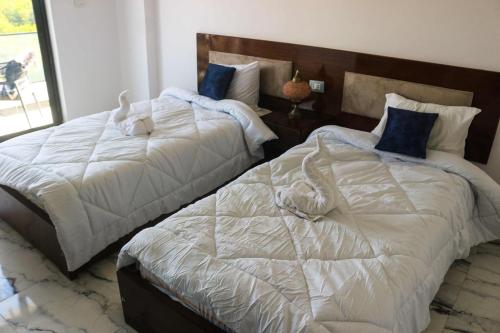 Ένα ή περισσότερα κρεβάτια σε δωμάτιο στο Flower of life guest house