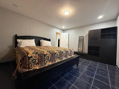 a bedroom with a bed and a television in it at Great Value Inn & Suites in West Sacramento