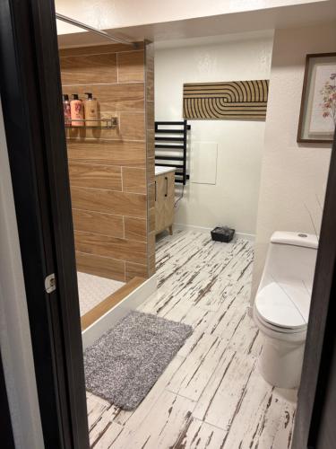 a bathroom with a toilet and a sink at The Cozy nest in Englewood