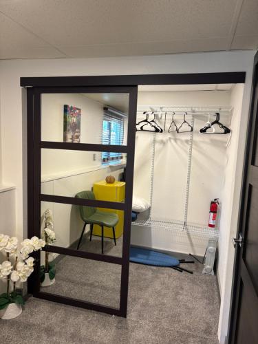 a room with a sliding glass door with a bedroom at The Cozy nest in Englewood