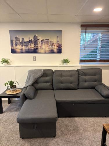 a living room with a couch in a room at The Cozy nest in Englewood