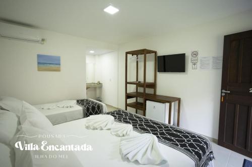 Letto o letti in una camera di Pousada Villa Encantada Ilha do Mel
