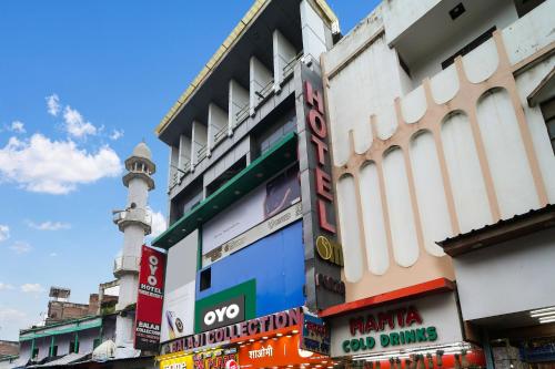a group of signs on the side of a building at Hotel O New Om Palace in Bhopal