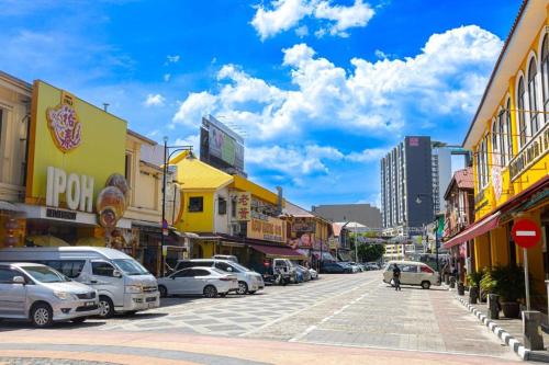 a city street with cars parked on the street at Miner's House Ipoh in Ipoh