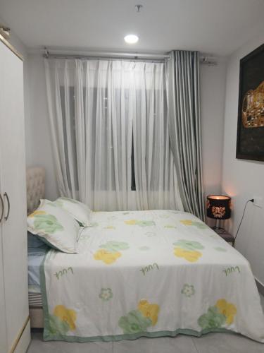 Ένα ή περισσότερα κρεβάτια σε δωμάτιο στο Service Apartment in Thuan An, Binh Duong