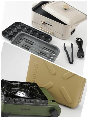 a table with a cell phone and a brief case at リバーサイドロッジ in Futtsu