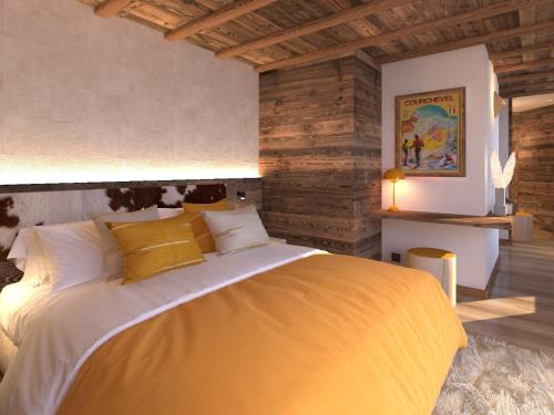 Ένα ή περισσότερα κρεβάτια σε δωμάτιο στο Chalet d'exception aux 3 Vallées, 14 pers, jacuzzi, sauna - FR-1-452-399