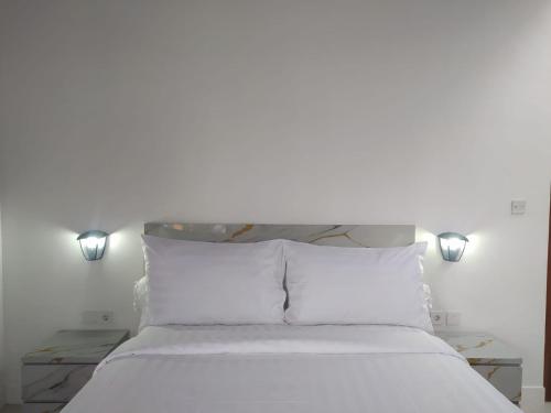 Ένα ή περισσότερα κρεβάτια σε δωμάτιο στο Hakimi Villa