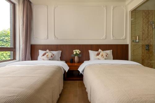 Postel nebo postele na pokoji v ubytování 铂诩海景客栈 BOXU Seaview Resort Villa