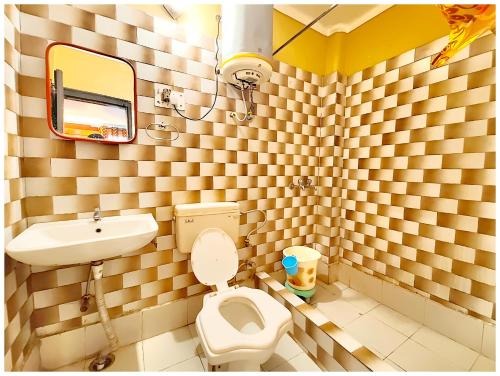 a bathroom with a toilet and a sink at Hotel Nainita Ankur ! Naini Lake View - On Terrace Open Restauarant with Lake View and Valley Mountain View with Wifi - Room Service Available - Best Vacation Stay with Family - Book Now in Nainital