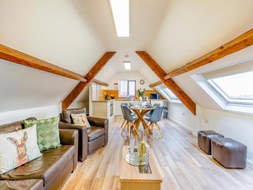 a living room with a couch and a table at Harebell- Uk45262 in Whitby