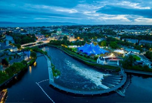an aerial view of a river at night at 3 Bedroom, 5 Bed Home in the Heart of Galway in Galway
