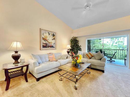 a living room with a couch and a table at Stoneybrook Condo #926 in Sarasota