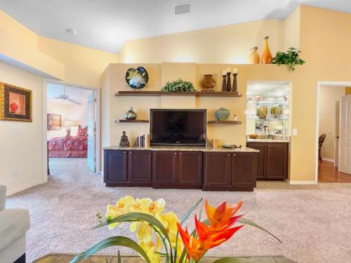 a living room with a flat screen tv at Stoneybrook Condo #926 in Sarasota