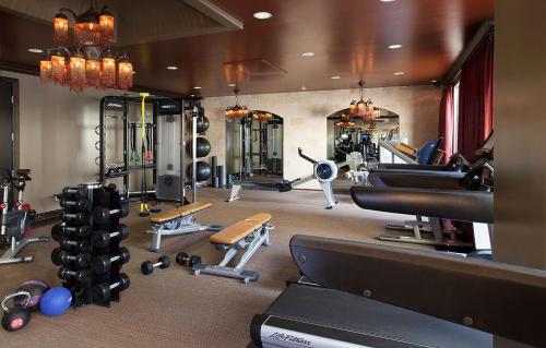 a gym with lots of equipment in a room at Hotel ZaZa Dallas in Dallas