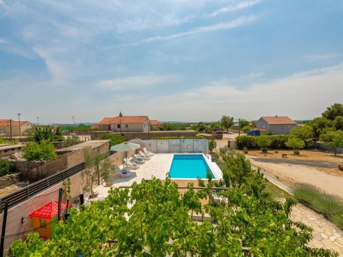 an overhead view of a pool at a resort at Holiday Home in Lisicic with Pool in Lisičići