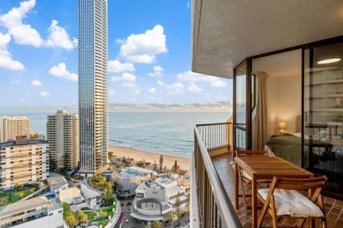 a balcony with a table and a view of the ocean at The Beachside - High Floor Ocean View 2BDR with Parking Pool & Gym in Gold Coast