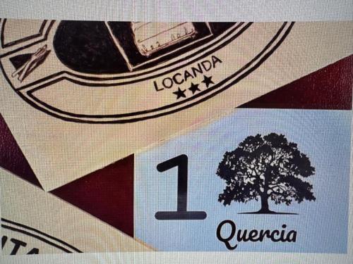 a sign for a car with a tree on it at La Locanda della Mandria 2 in Venaria Reale