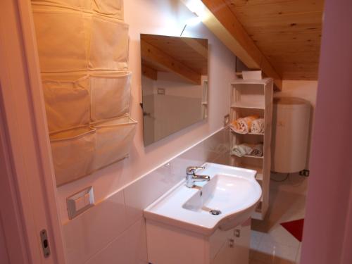 a bathroom with a sink and a mirror at Apartments Bea in Lovran