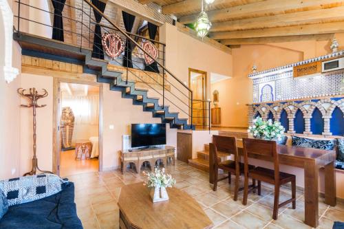 a living room with a table and a staircase at Mundobriga in Munébrega