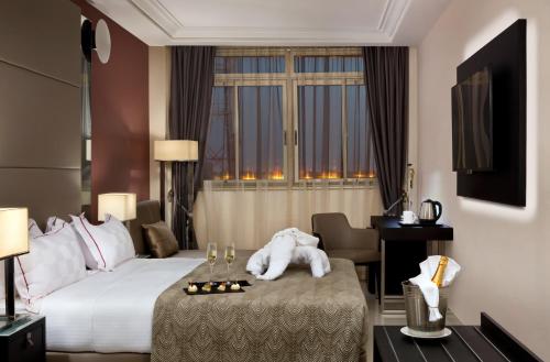 Postel nebo postele na pokoji v ubytování Bravia Hotel Ouagadougou